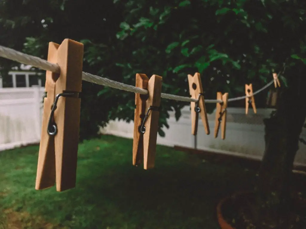 Wooden pegs on a clothes line to hang hand washed maxi dresses
