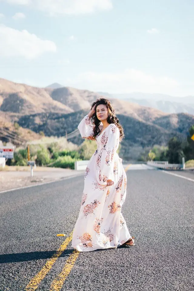 Woman with a white maxi floral maxi dress