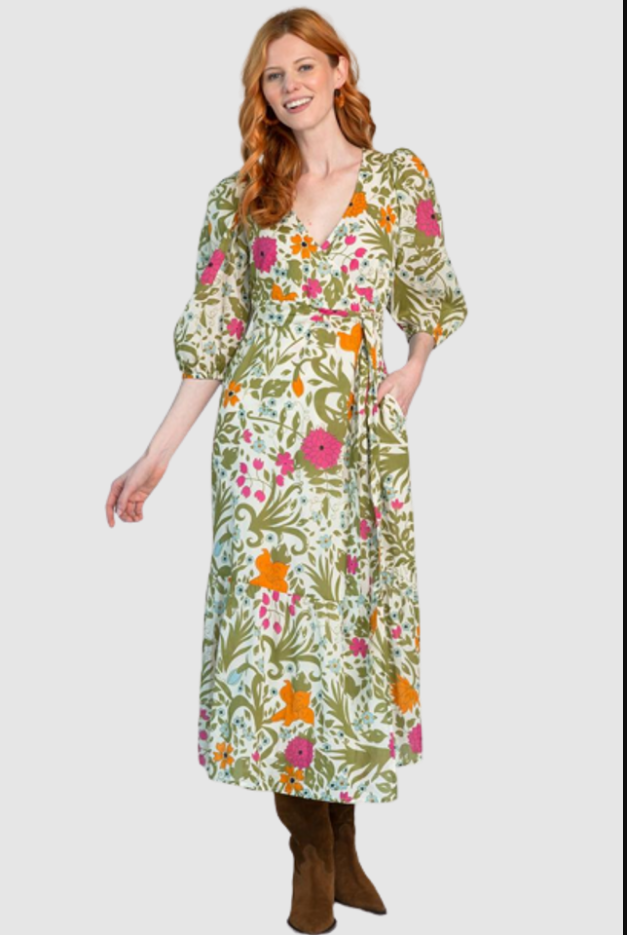 A woman wearing a floral maxi dress with pockets from Monkees MP