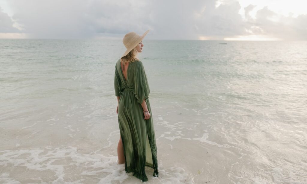 Woman in a green maxi dress beach maxi dress