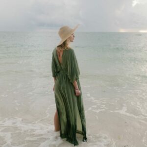 Woman in a green maxi dress beach maxi dress